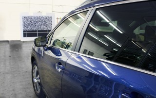 A SUV undergoes ADAS calibration at an All Star location.